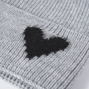 Light gray chunky knit beanie for women featuring a black fuzzy heart jacquard pattern