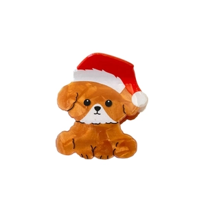 Cute orange puppy hair claw with red Santa hat made of glossy acetate resin