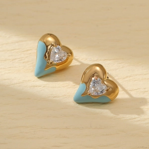 Golden heart stud earrings with sky blue enamel and clear zircon center detail