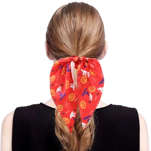 Halloween red satin hair ribbon with pumpkin ghost print on light brown hair