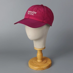 Magenta quick-dry baseball cap with white 'Dreams Come True' embroidery for sports