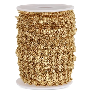 Golden stainless steel heart-shaped link chain on white spool for DIY jewelry making
