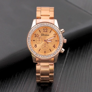 Close-up of rose gold Geneva watch with diamond-set bezel and alloy strap detail