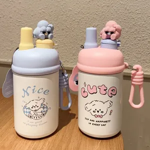 Detailed view of cartoon stainless steel tumblers with 3D figure lids and silicone straps