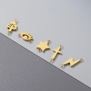 Golden stainless steel connectors with tree, evil eye, and star motifs for jewelry making