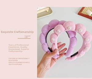 Close-up of plush cloud headbands with pearls and anti-slip teeth in pink and purple