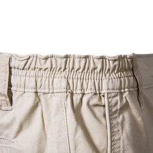 Men's khaki cotton cargo shorts featuring a flexible elastic waistband and straight fit