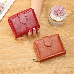 Short vintage leather wallet for women with zipper and snap button in red and brown