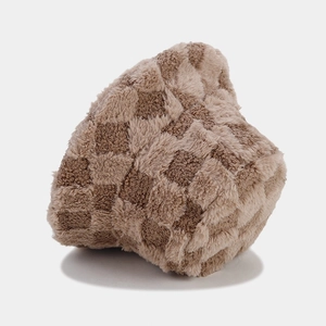 Close-up of brown and beige checkerboard plush bucket hat with thick faux fur texture