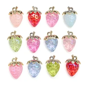 Set of twelve colorful translucent strawberry pendants with gold leaf hooks for DIY jewelry