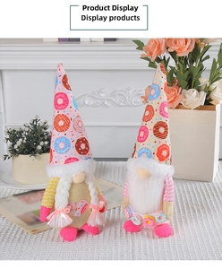 Detailed view of donut themed gnomes plush set with pink hat and braided hair detail