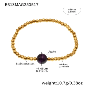 Detail of beaded bracelet with 18K gold plated stainless steel and purple agate bead
