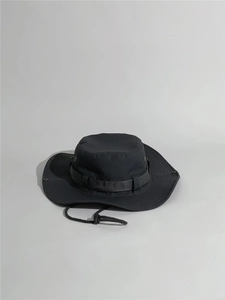 Detail view of black outdoor sun hat with adjustable chin strap and side snaps
