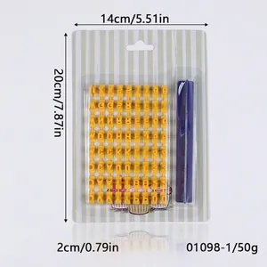 Detailed macro view of yellow plastic alphabet and number stamps for DIY cookie baking