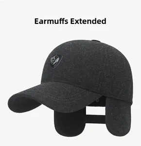 Detail view of winter baseball cap with unfolded ear flaps and metal shield logo