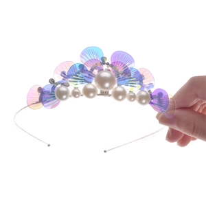 Detailed shot of kids mermaid crown with purple and blue gradients and imitation pearls