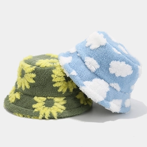 Winter floral plush bucket hats in army green sunflower and light blue cloud designs