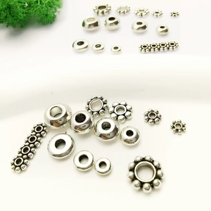 Collection de perles d'espacement flocon de neige en argent tibétain pour bijoux DIY