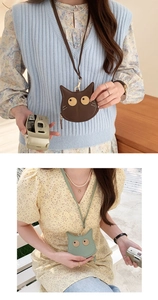 Detail of cat-shaped PU leather neck coin purses in dark brown and light green colors