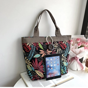 Canvas tote bag with colorful leaves and iPad to show large storage capacity