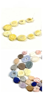 Macro detail of irregular natural crystal flower stone beads in vibrant assorted colors