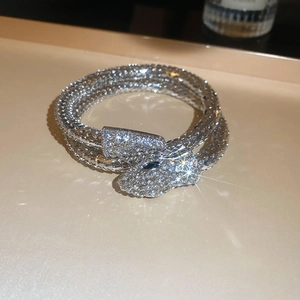 Macro view of silver multi-layered snake bracelet with sparkling crystal rhinestones