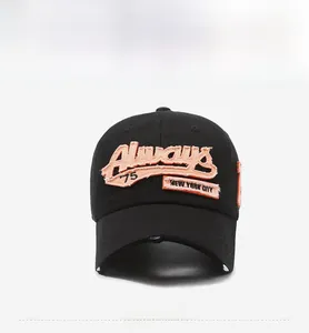 Close-up of Always '75 orange 3D embroidery on black vintage distressed baseball cap