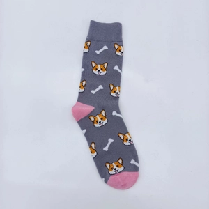 Flat lay detail of dark grey cotton crew socks with pink accents and Corgi patterns