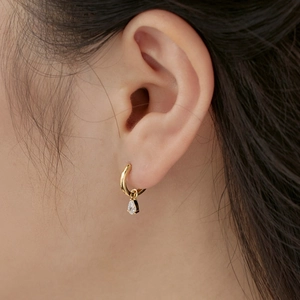 Elegant gold S925 silver hoop earrings with water drop zircon pendants on female model