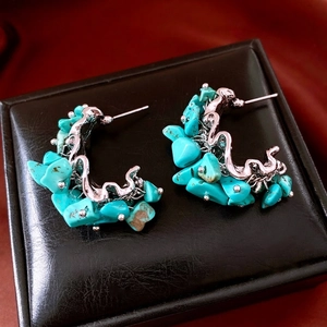 Vintage irregular turquoise stone earrings with silver metallic wavy semi-circle design