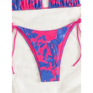Close-up of pink and blue marble print bikini bottom with adjustable side tie design