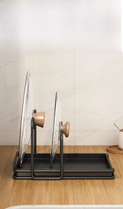 Detail view of the stable carbon steel pot lid rack with matte finish on a kitchen counter