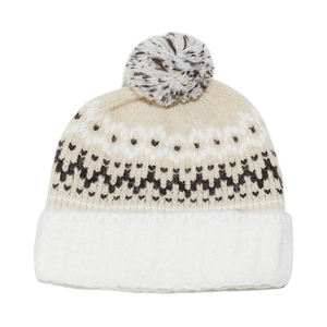 Close-up of Fair Isle knit beanie with a fluffy pompom and thick plush fold-over cuff