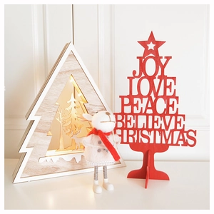 Festive Christmas wooden decorations featuring a reindeer figure and a lit Xmas tree