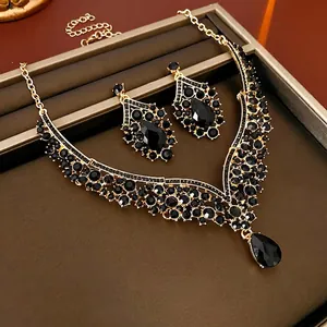 Luxury V-shaped teardrop necklace and earrings set with black crystals in gold finish