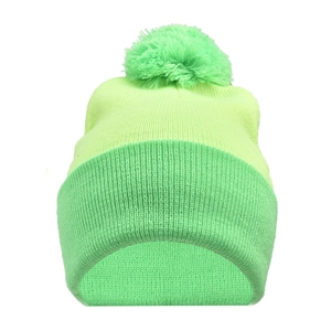 Detailed knit texture of fluorescent green winter beanie with fluffy pom-pom top