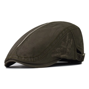 Close-up of olive green cotton flat cap featuring vintage embroidery and metal buckle