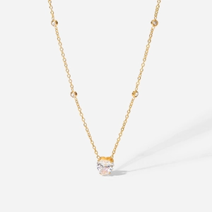Detail showing the 18K gold plated heart pendant with zircon stones on a gold chain
