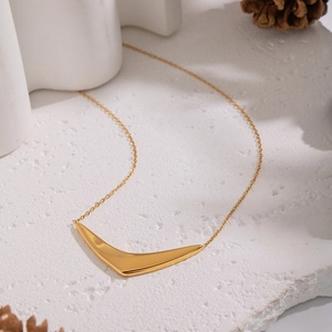 Elegant 18K gold plated stainless steel V-shaped necklace on a minimalist stone setting