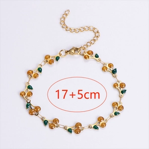 Golden cherry bracelet with orange sequins and green leaves, 17cm plus 5cm extender