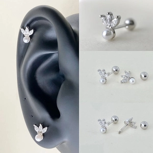 Detailed views of 925 silver cartilage stud with crown design, marquise zircon and pearl