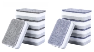 Detail view of double-sided grey scouring pad and white sponge for kitchen cleaning