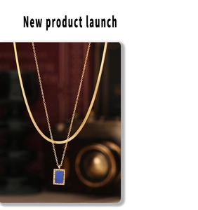 Close-up of double-layer 18K gold-plated snake chain with blue lapis lazuli square pendant