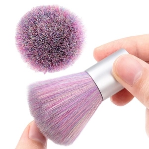Nail dust cleaning brush with rainbow bristles and silver handle on white background