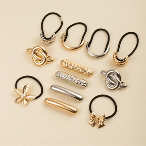 Minimalist gold and silver metal hair ties set featuring bow and floral pearl designs