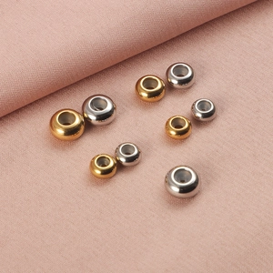 Assorted gold and silver stainless steel slider beads with silicone inserts for DIY jewelry