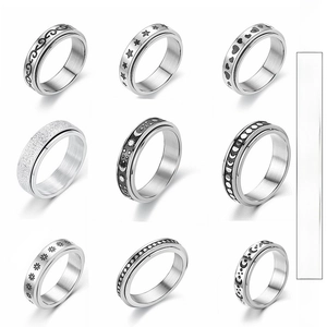 Detailed grid view of nine rotatable stainless steel stress relief rings with stars and moon