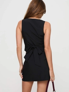 Women's black sleeveless backless top and skirt set with a large back bow detail