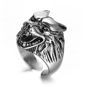 Detailed close-up of antique silver wolf head ring with vintage punk aesthetic carvings