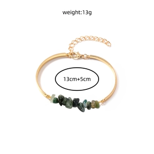 Detail of gold chain bracelet with green natural crushed stones and lobster clasp